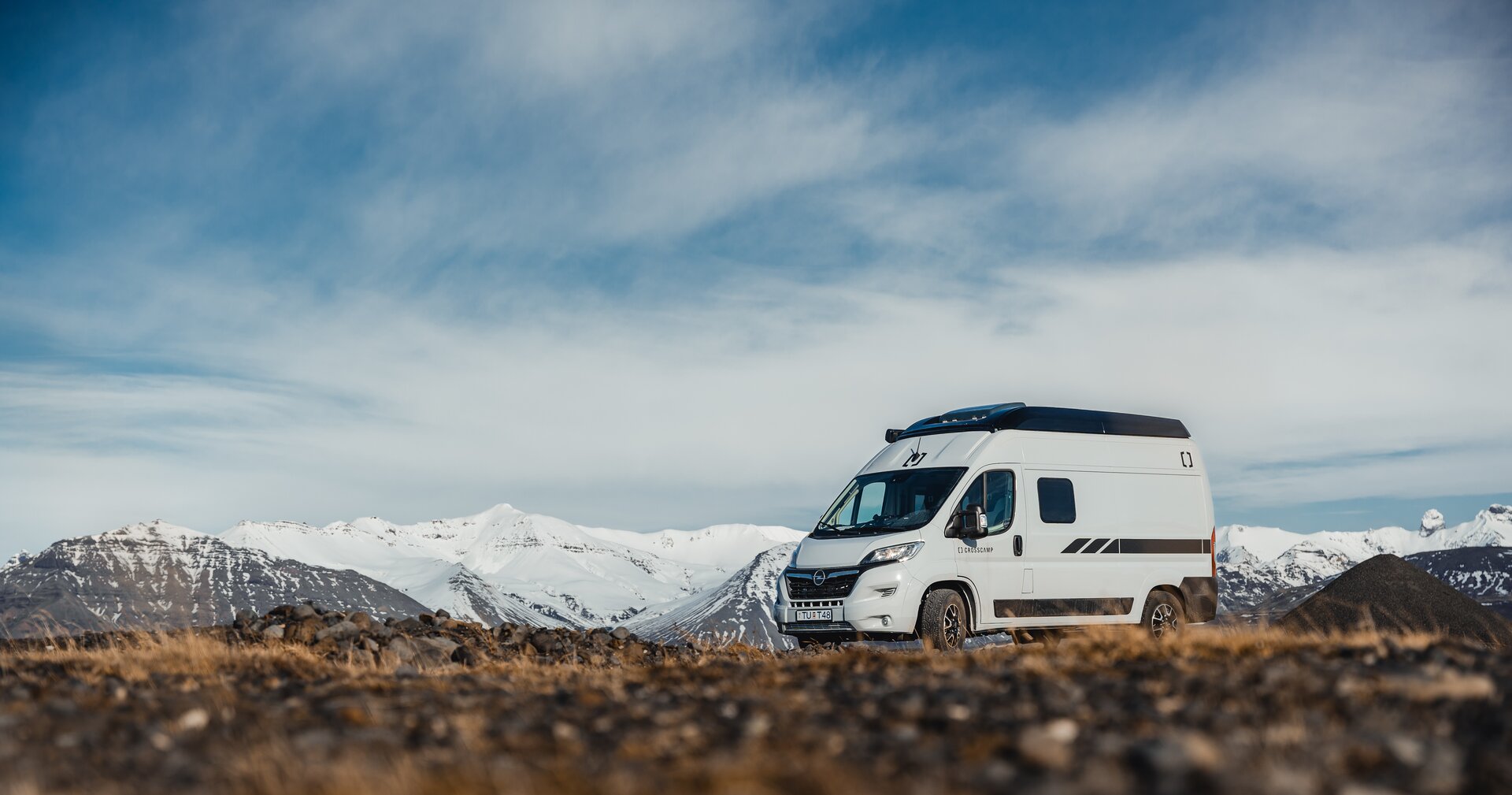 white campervan parked in a scenic landscape