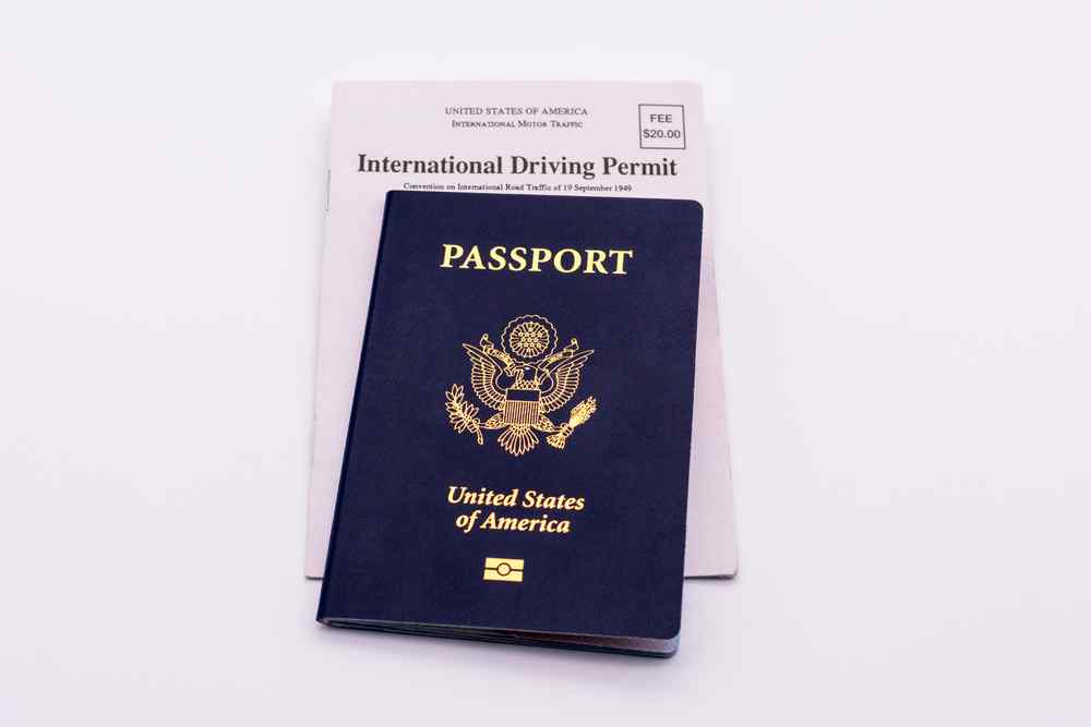 International Driving Permit in Iceland United States passport placed on top of an international driving permit.