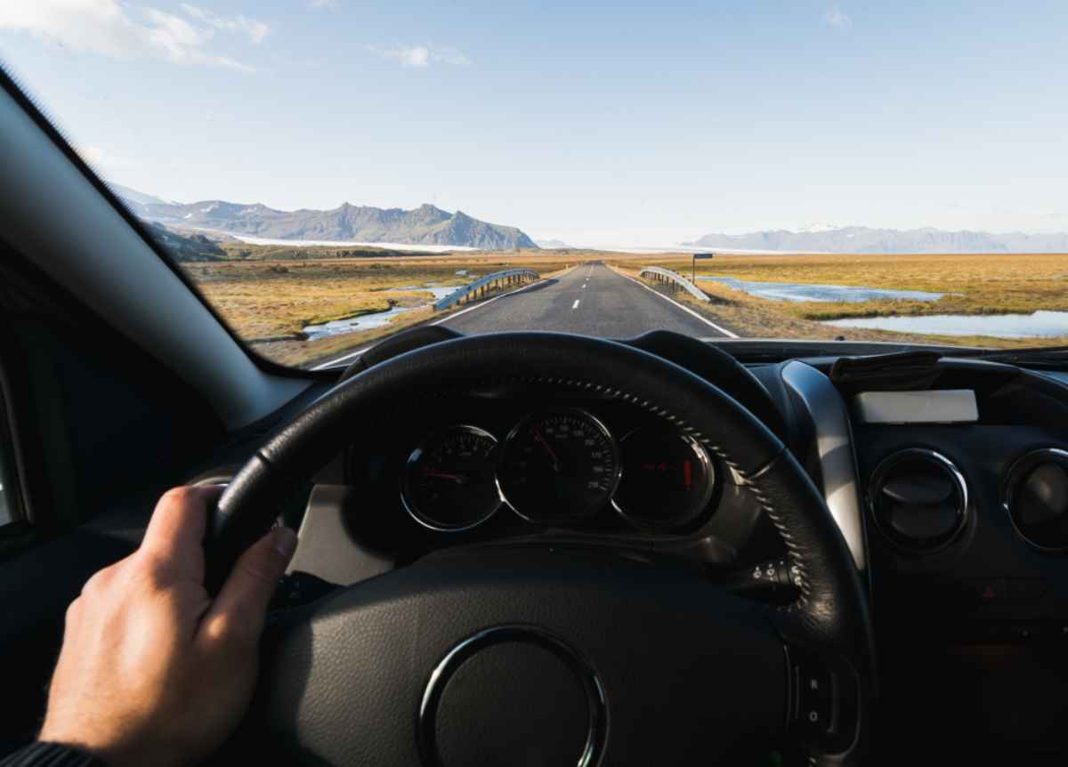 A vehicle on an Icelandic road slows down to less than 90 km/hour to comply with road regulations and reduce fuel consumption.