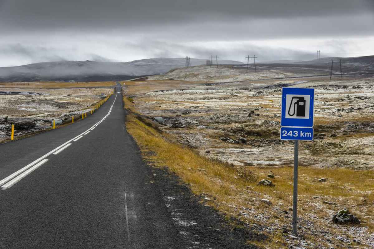Gas station road sign with more than 200km apart
