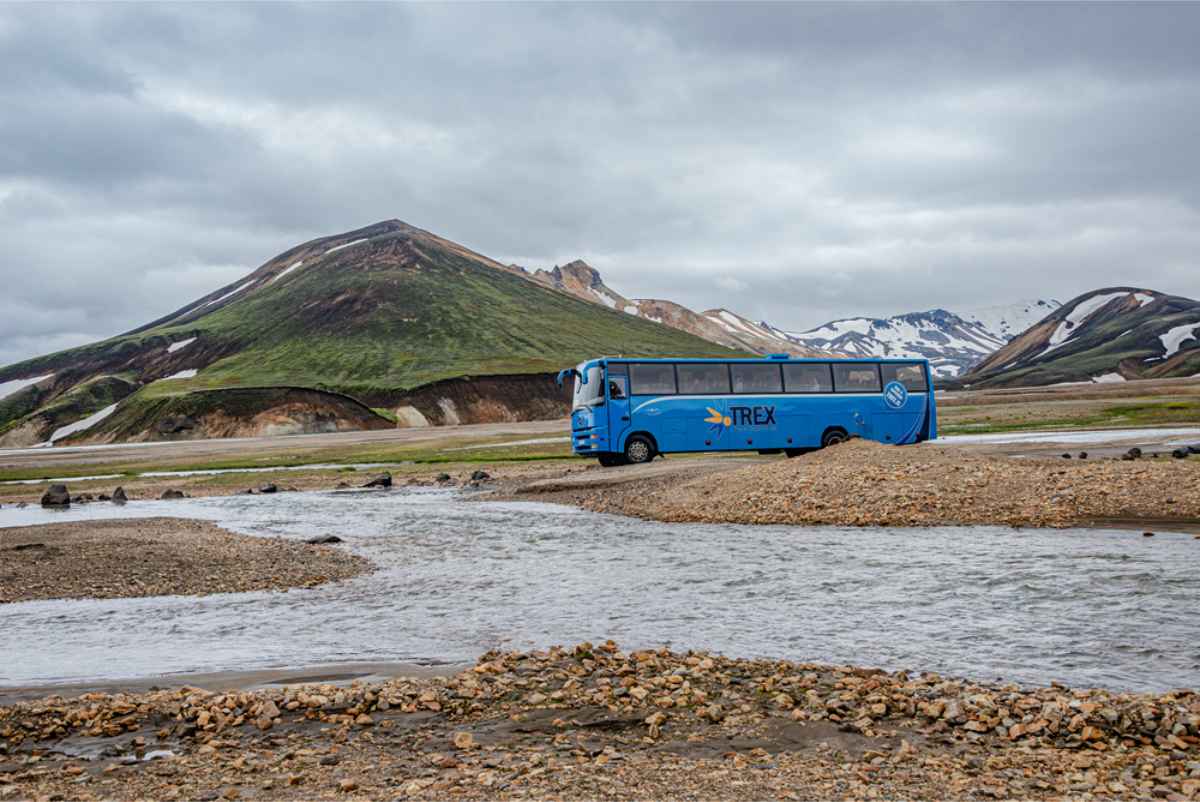4x4 bus tour about to cross a river in Iceland's highlands